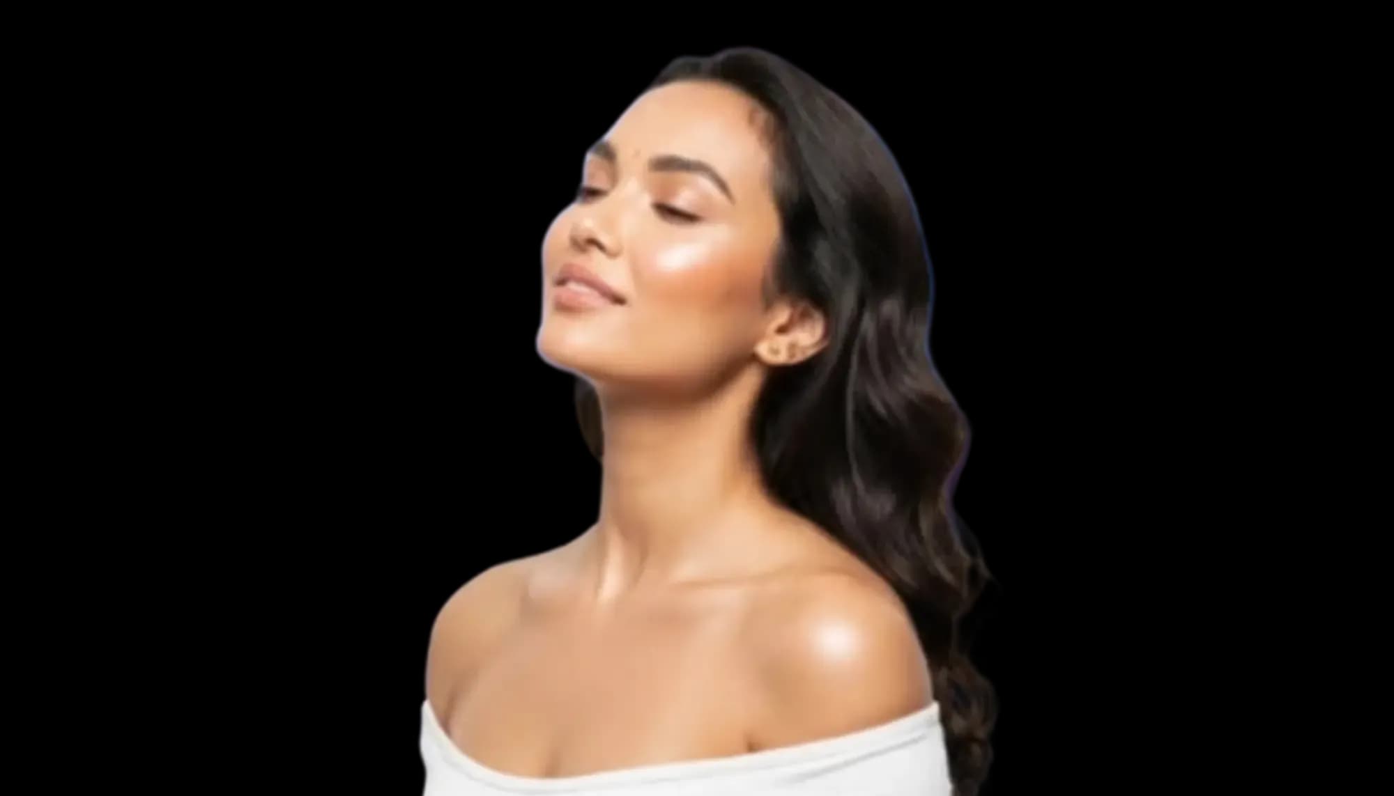 Woman with glowing skin, eyes closed, bare shoulders in a white off-shoulder top
