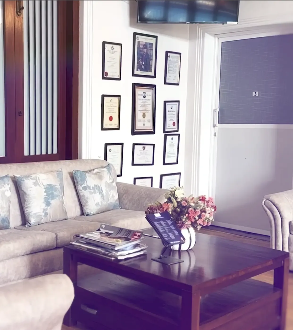 Luxskin waiting room in Nawala, Colombo, with Dr Dineli framed medical certificates on the wall
