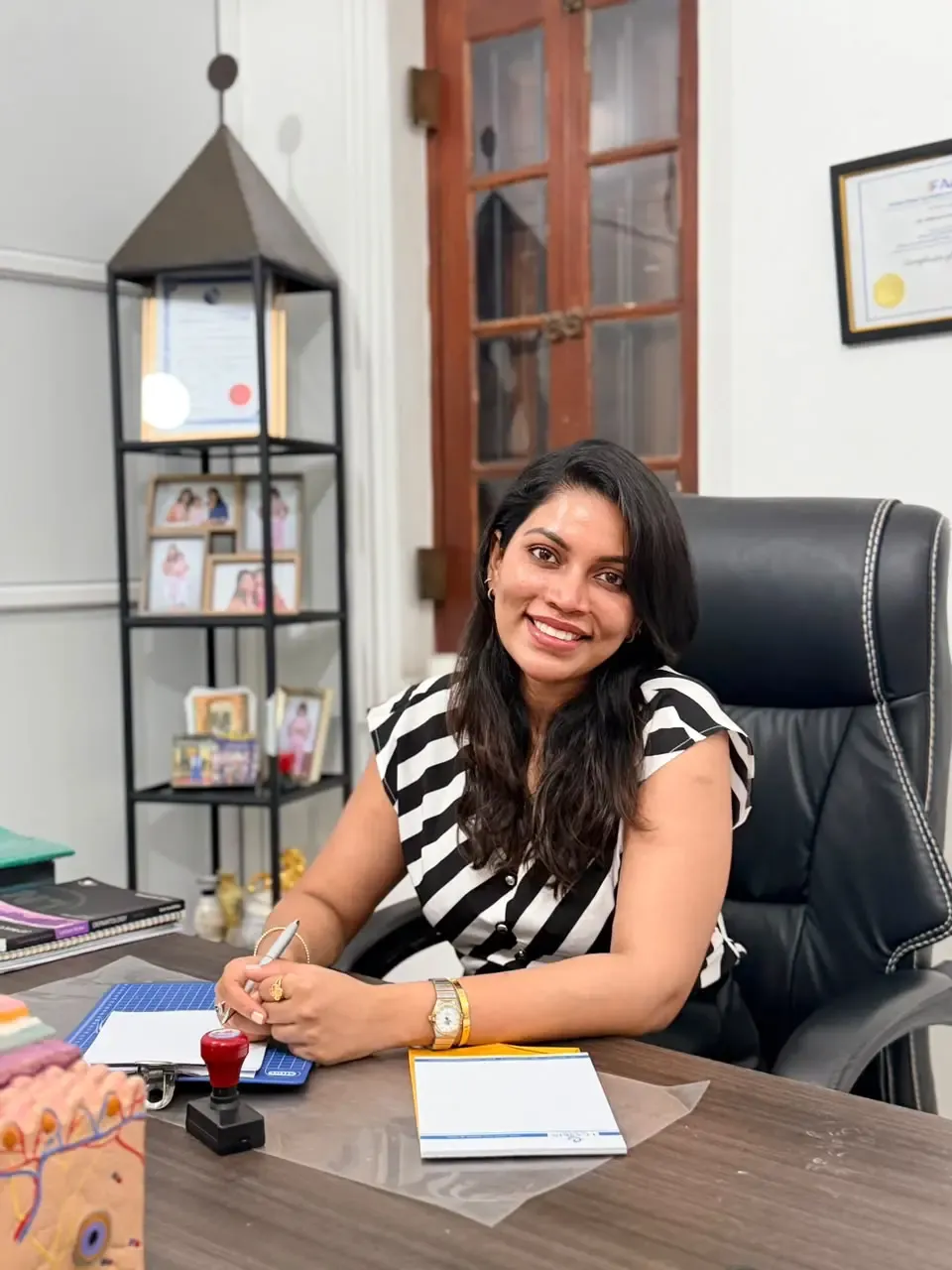 Dr Dinelka Samarajeewa at her consultation desk at Luxskin